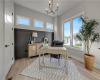 Gleaming hardwood floors and a modern light fixture elevate this quiet home office space.