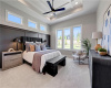 High coffered ceilings and generous windows define this elegant bedroom retreat.