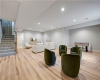 Smooth wood flooring and clean lines define this versatile lower level space.