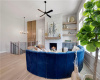 An elegant stone fireplace anchors this light-filled room complete with warm hardwood floors.